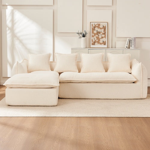 Oversized L-shape three-seat sofa with chaise deep cushions and neutral upholstery