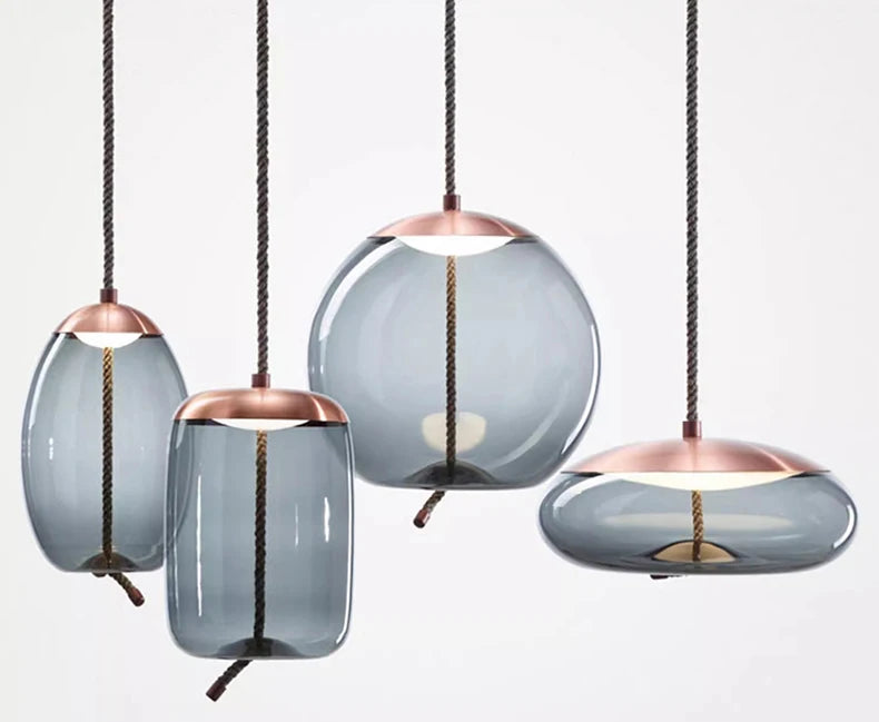 Modern LED Pendant Light — Chandelier for Living & Dining Room featuring four smoked glass pendant lights with copper tops and twisted rope cords, offering a sculptural statement lighting design.