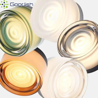 Glass stone LED wall sconce with textured translucent shade and warm wall glow