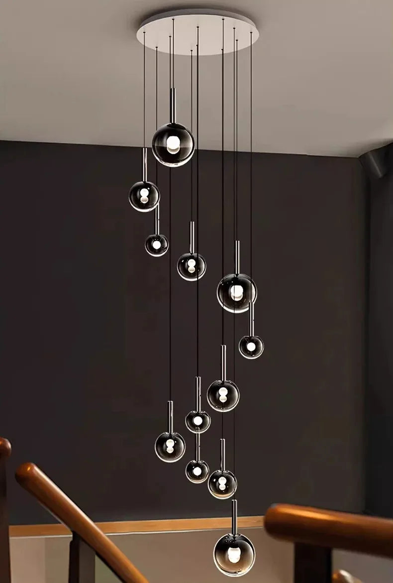 Nordic Stair Chandelier — Living & Dining Room Pendant Ceiling Light featuring multiple hanging glass orbs with minimalist black and chrome accents, perfect for luxury home décor and modern pendant lighting.