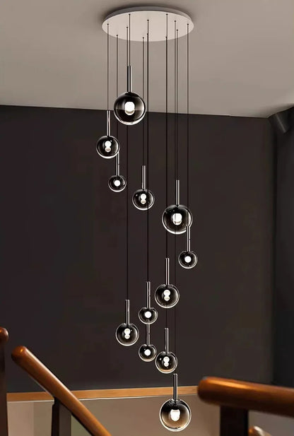 Nordic Stair Chandelier — Living & Dining Room Pendant Ceiling Light featuring multiple hanging glass orbs with minimalist black and chrome accents, perfect for luxury home décor and modern pendant lighting.