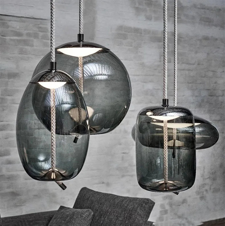 Modern LED Pendant Light — Chandelier for Living & Dining Room featuring three unique smoky glass globe shades with braided cords, offering minimalist pendant lighting for a contemporary space.