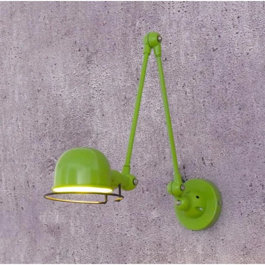 Industrial vintage wall sconce with black metal frame and clear glass shade