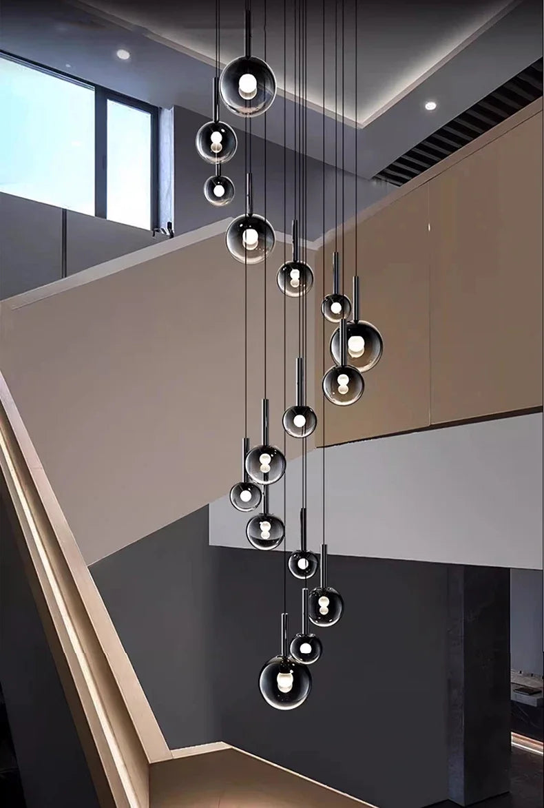 Elegant Nordic Stair Chandelier — Living & Dining Room Pendant Ceiling Light featuring multiple suspended glass orbs with exposed bulbs, creating a modern statement for luxury home décor.