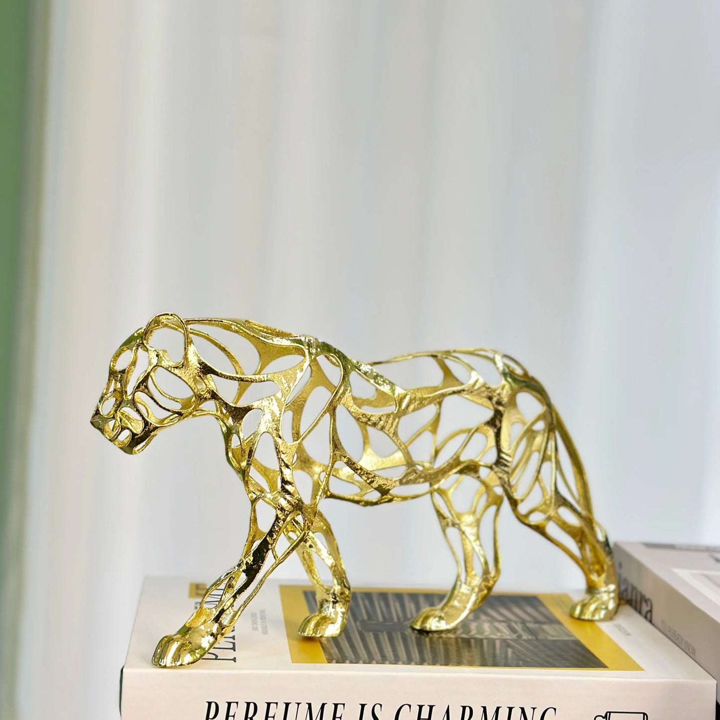 Nordic Metal Leopard Sculpture — Living Room Desktop Home Décor gold-toned sculptural accent with an openwork design, ideal for luxury home décor and modern minimalist interiors.