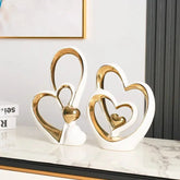 Heart-shaped ceramic and enamel luxury home accent decor piece with glossy finish on a wooden surface