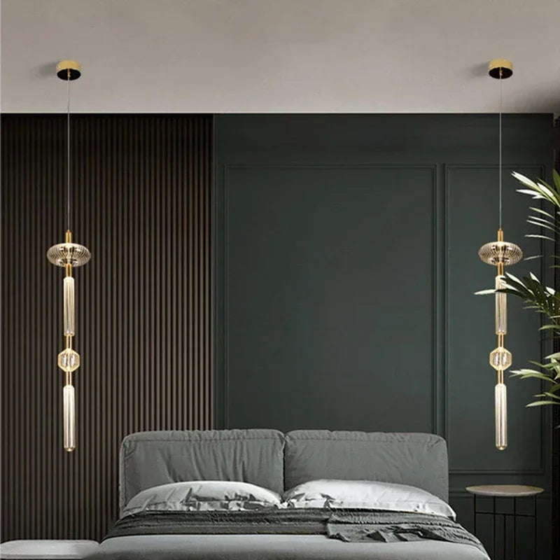 Modern bedroom interior featuring a pair of Nordic Luxury Art Glass Chandelier — High-End Pendant Lamp Home Décor suspended symmetrically above each side of a minimalist bed with dark textured walls and subtle decorative accents.
