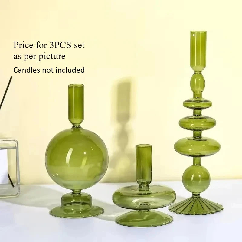 Three colored glass candle holders in amber green and smoky gray with fluted texture