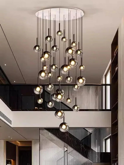 Modern and elegant Nordic Stair Chandelier — Living & Dining Room Pendant Ceiling Light featuring multiple glass orbs suspended at varying heights, perfect for luxury home décor and statement lighting in a contemporary space.