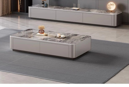 Nordic Clear Designer Coffee Table — Minimalist Living Room Décor with a sleek marble top and smooth edges, set on a textured gray rug in a modern, stylish living space.