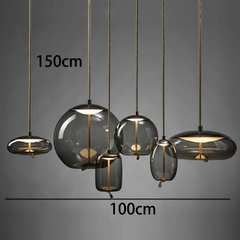 Modern LED Pendant Light — Chandelier for Living & Dining Room featuring six varying smoke-gray glass globes suspended by thin cords, ideal for elegant pendant lighting and luxury home décor.