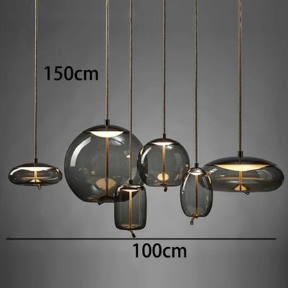 Modern LED Pendant Light — Chandelier for Living & Dining Room featuring six varying smoke-gray glass globes suspended by thin cords, ideal for elegant pendant lighting and luxury home décor.