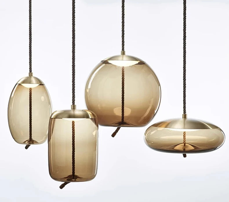 Modern LED Pendant Light — Chandelier for Living & Dining Room featuring four amber-toned glass pendants with bronze fittings, offering a stylish, minimalist statement lighting for contemporary spaces.