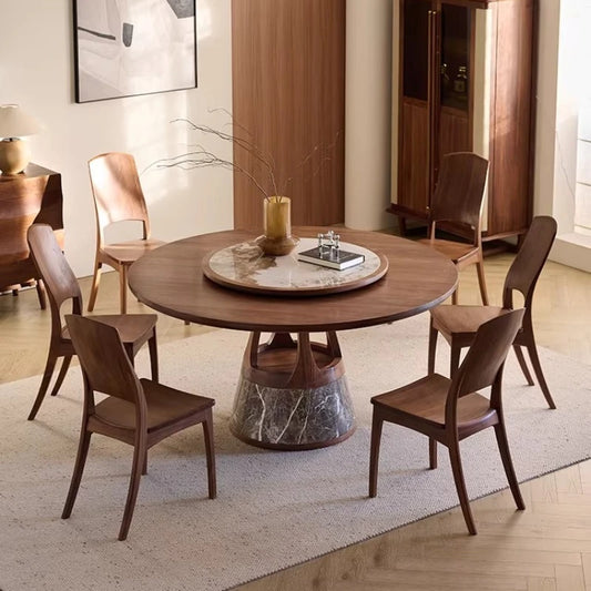 Solid wood round dining table with mid-century pedestal base and warm natural grain