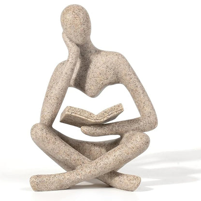 Abstract thinker sculpture with seated figure pose and smooth black display base