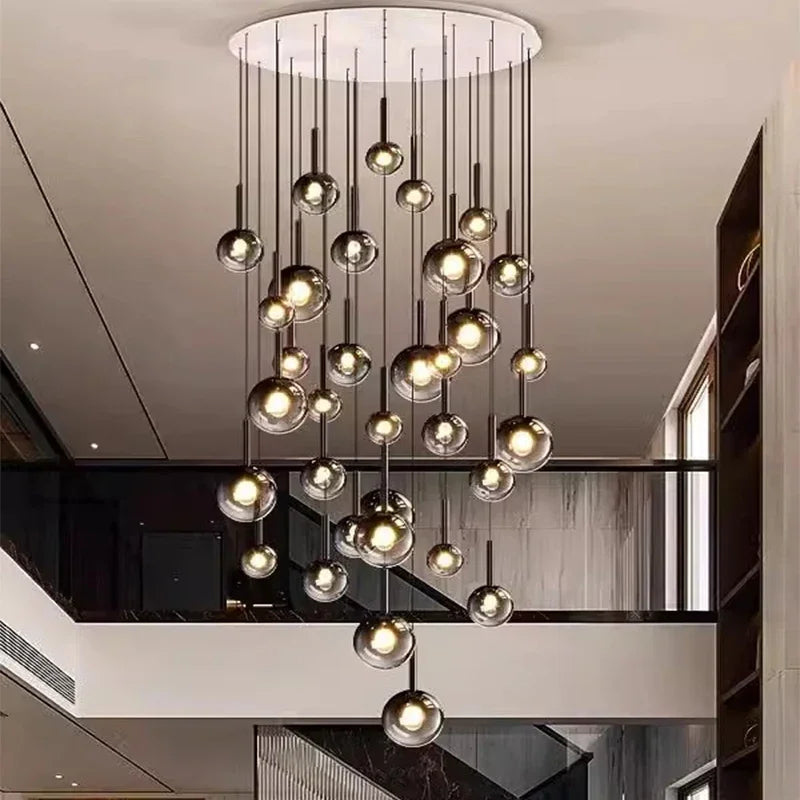 Elegant Nordic Stair Chandelier — Living & Dining Room Pendant Ceiling Light with multiple glowing orbs suspended at varying heights, perfect for modern luxury home décor and statement lighting.