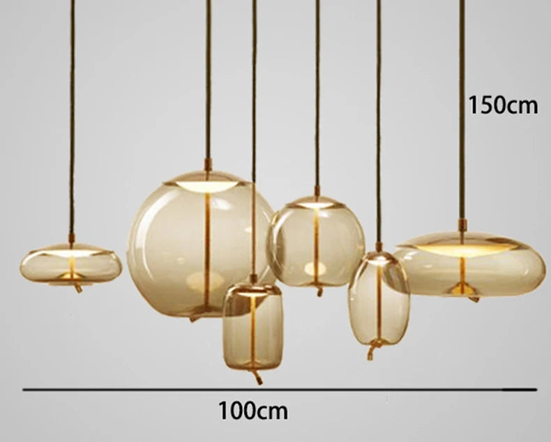 Modern LED Pendant Light — Chandelier for Living & Dining Room featuring six amber glass pendant lights with organic shapes and brass accents, perfect for luxury home décor.