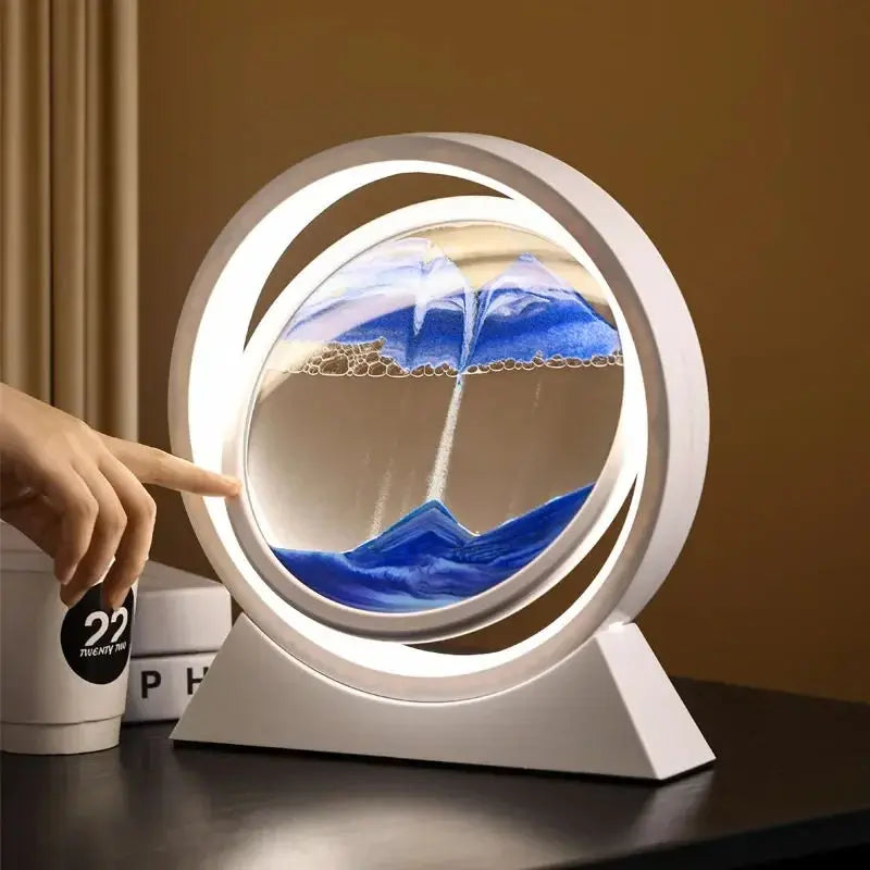 Round sand art lamp with blue moving sand white LED ring and tabletop base