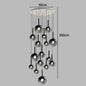 Nordic Stair Chandelier — Living & Dining Room Pendant Ceiling Light featuring multiple black glass globe pendants suspended at varying heights for a modern Nordic design.