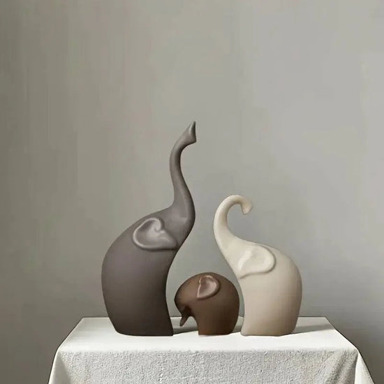 Nordic matte ceramic elephant family figurines symbolizing strength and loyalty on a minimalist shelf