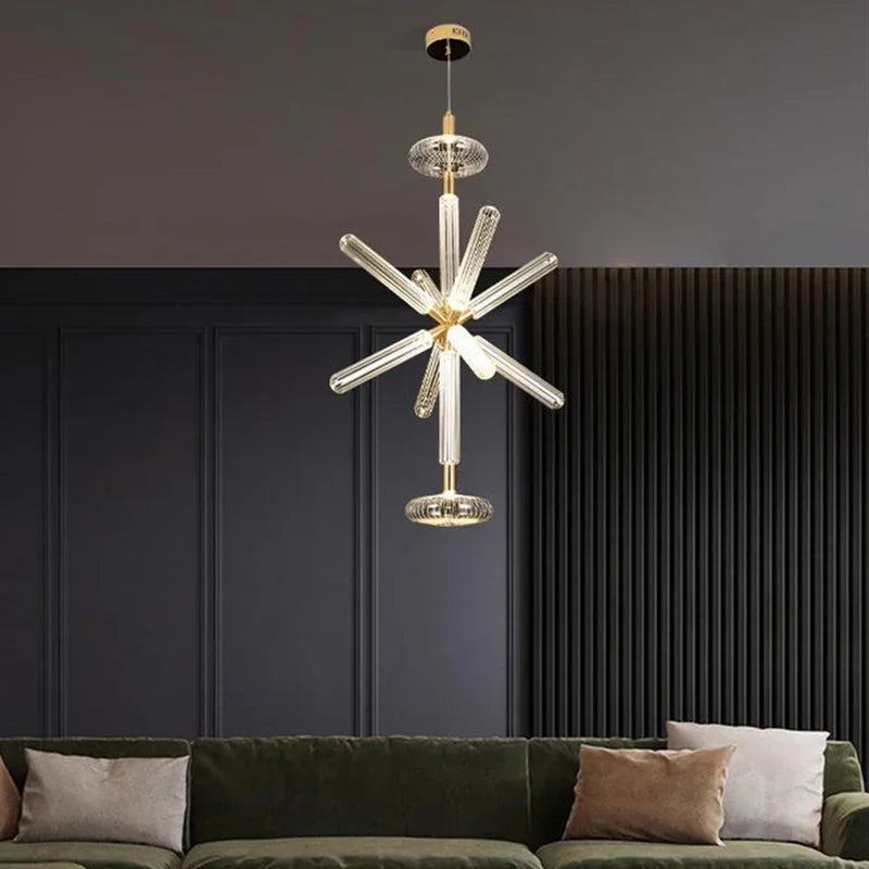Nordic Luxury Art Glass Chandelier — High-End Pendant Lamp Home Décor hanging above a modern living room sofa, featuring clear elongated glass elements and gold accents for luxury home décor.