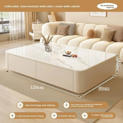 Nordic Clear Designer Coffee Table — Minimalist Living Room Décor featuring a large white slate tabletop with rounded corners, cream cabinet with drawers, and soft modern design in a cozy living room.