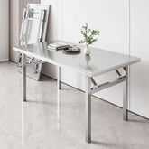 Foldable stainless steel buffet table with X-fold design set up for serving in dining room